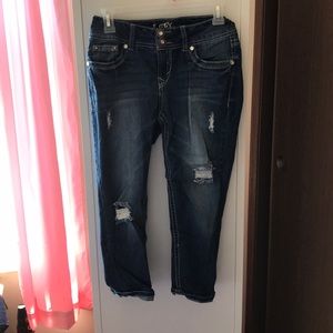 a pair of ripped Capri jeans :)